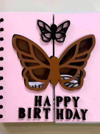 Handcrafted butterfly wooden birthday card with spiral binding and happy birthday text