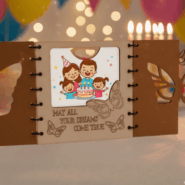 Butterfly wooden happy birthday card displayed with gift boxes and ribbons