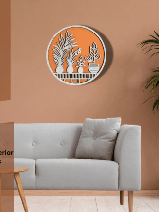 Circular wooden wall hanging with botanical design mounted on a light-colored wall Caption: