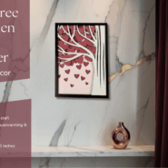 Handcrafted wooden Love Tree wall hanging with heart design displayed on marble wall interior.