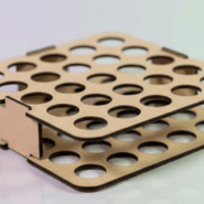 Wooden cosmetic rack holding various lipsticks and glosses in a dark, luxury boudoir setting with wood-paneled shelving.